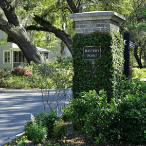 A brick column with a sign that reads Battery Point.